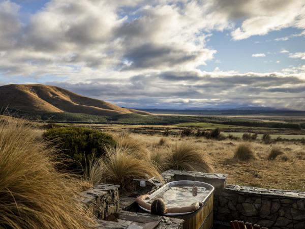 Dreamaroo Luxury, Woman in BathTub Outdoors View of Safari and Mountains Image