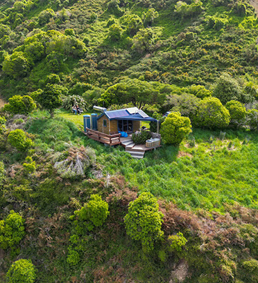 Dreamaroo Luxury, Private Stays New Zealand, View of House Surrounded by Green Trees/Nature From Above Image