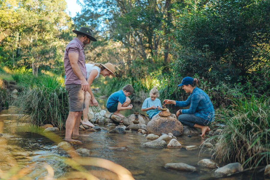 Dreamaroo Luxury, Mount Barney Lodge, Family/Group Trip to Forest, Kids Stacking Stones In A Pond Image